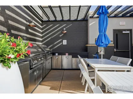 a kitchen with a table chairs and a stove