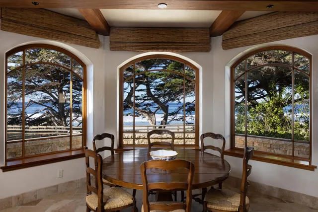 a view of a porch with a floor to ceiling window