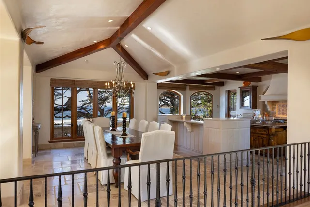 a kitchen with stainless steel appliances granite countertop a sink a stove and a wooden cabinets