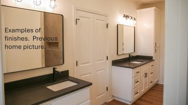a bathroom with a double vanity sink and a mirror
