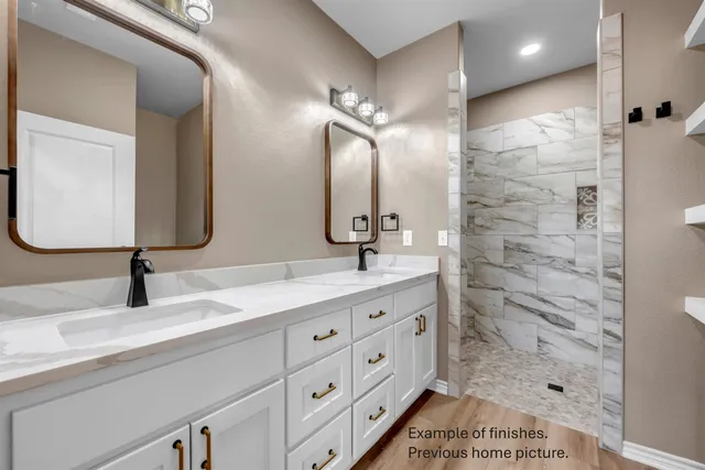 a bathroom with a sink a toilet and bathtub