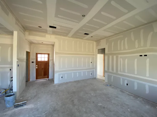 a view of an empty room and window