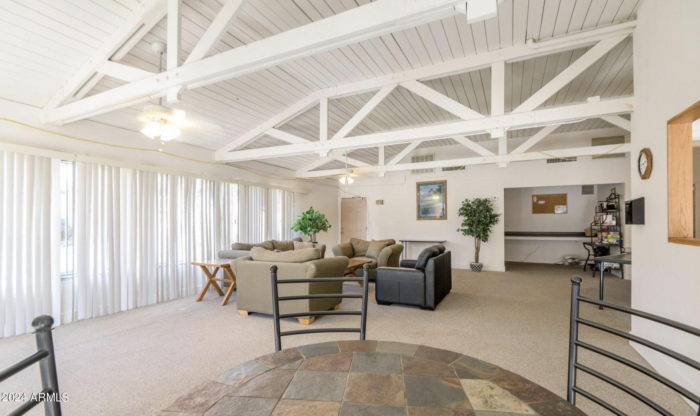 7550 North 12th Street, Unit 121 Phoenix, AZ 85020 - Photo 20 of 21 a living room with furniture and a window