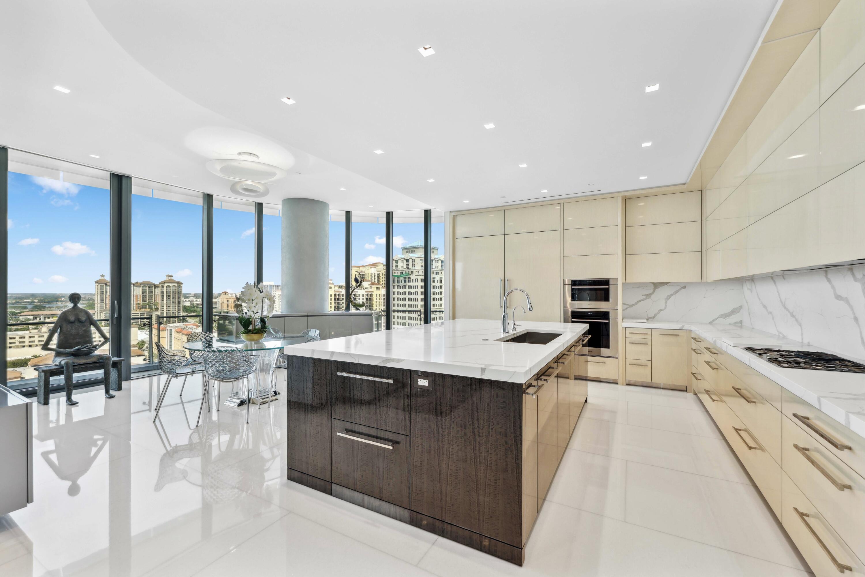 1100 South Flagler Drive, Unit 1801 West Palm Beach, FL 33401 - Photo 12 of 56 a large kitchen with a large counter top appliances and cabinets