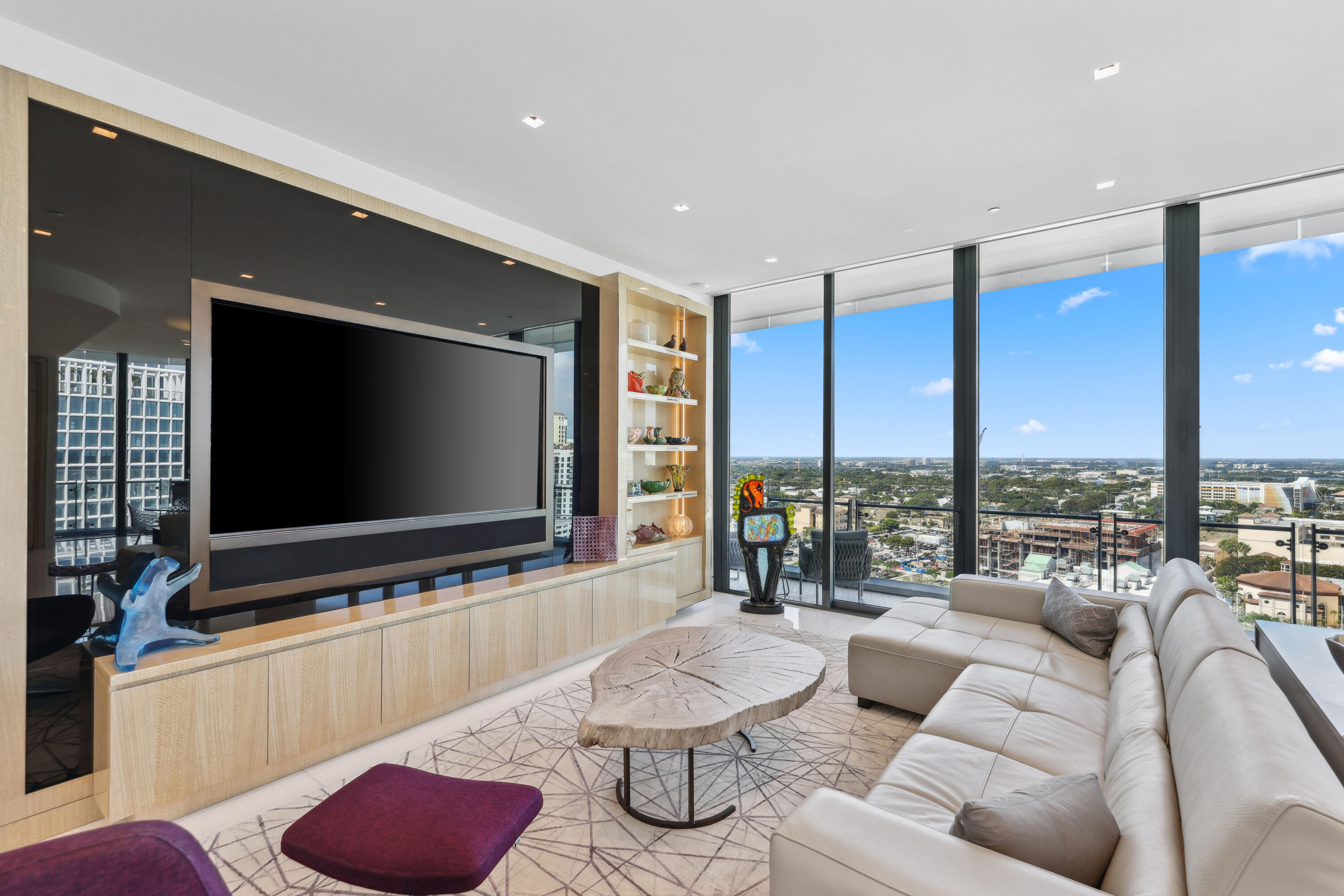 1100 South Flagler Drive, Unit 1801 West Palm Beach, FL 33401 - Photo 16 of 56 a living room with furniture and a flat screen tv