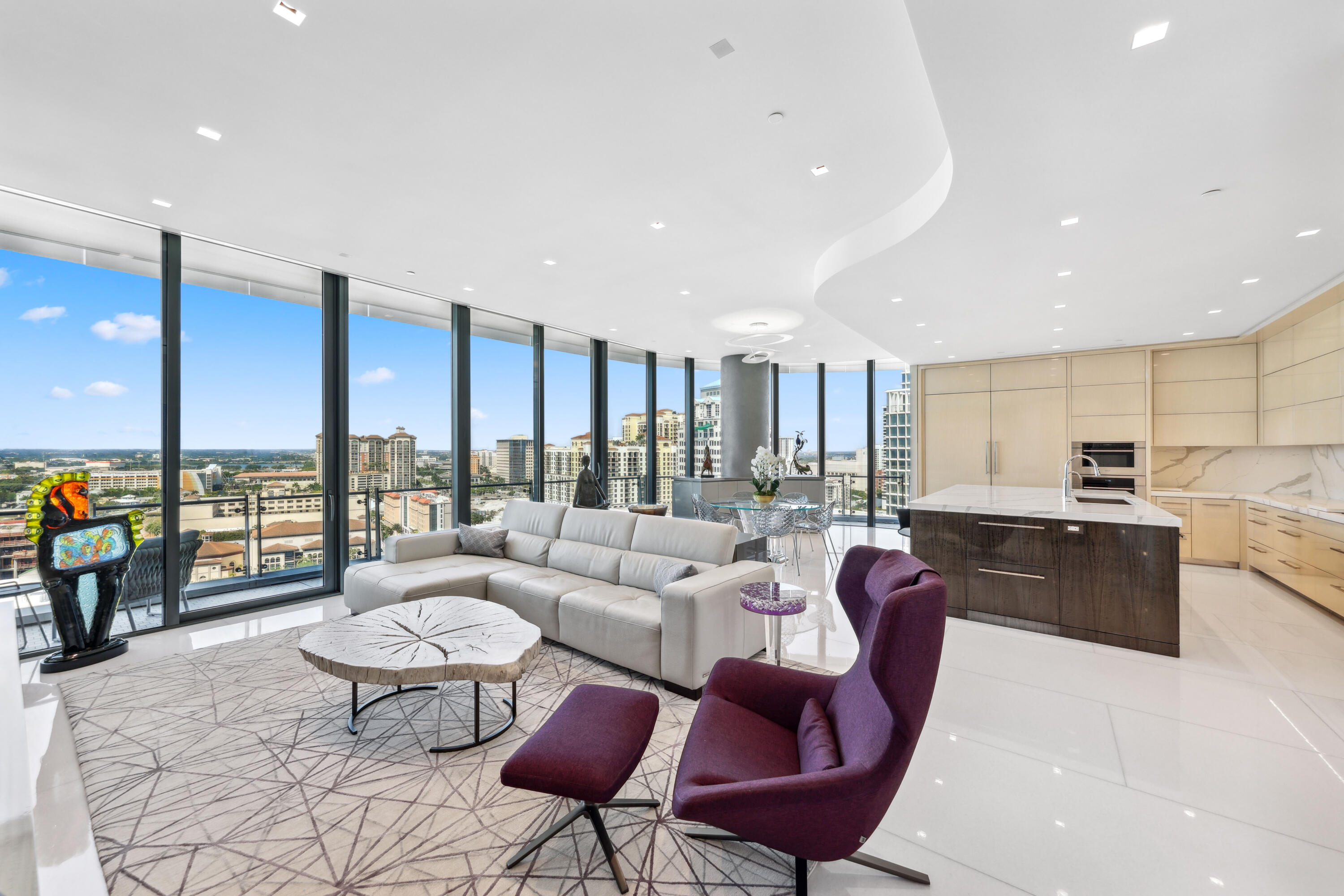 1100 South Flagler Drive, Unit 1801 West Palm Beach, FL 33401 - Photo 17 of 56 a living room with furniture kitchen view and large windows