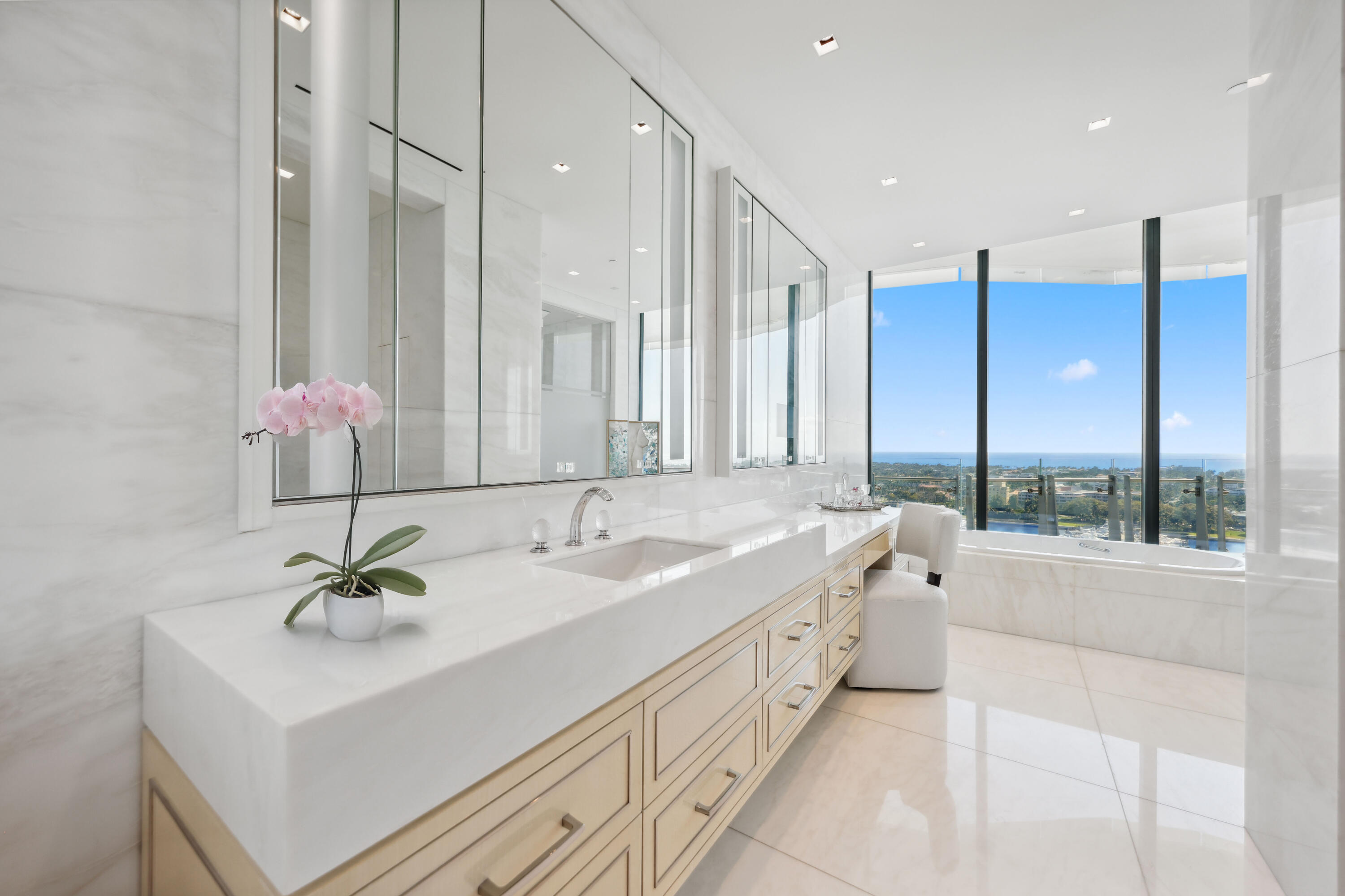 1100 South Flagler Drive, Unit 1801 West Palm Beach, FL 33401 - Photo 20 of 56 a bathroom with a double vanity sink a mirror and a bathtub