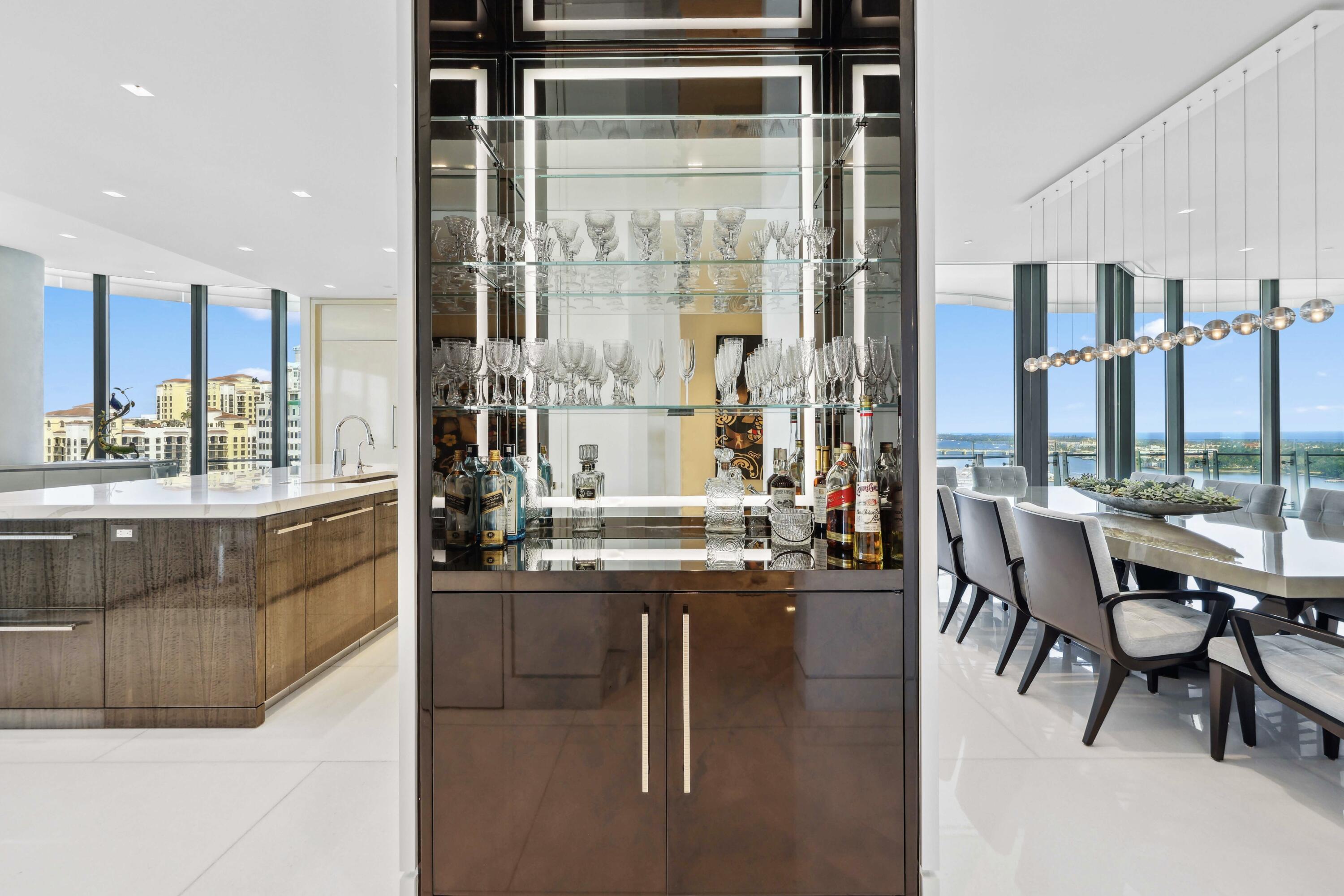 1100 South Flagler Drive, Unit 1801 West Palm Beach, FL 33401 - Photo 27 of 56 a kitchen with kitchen island granite countertop a table and chairs