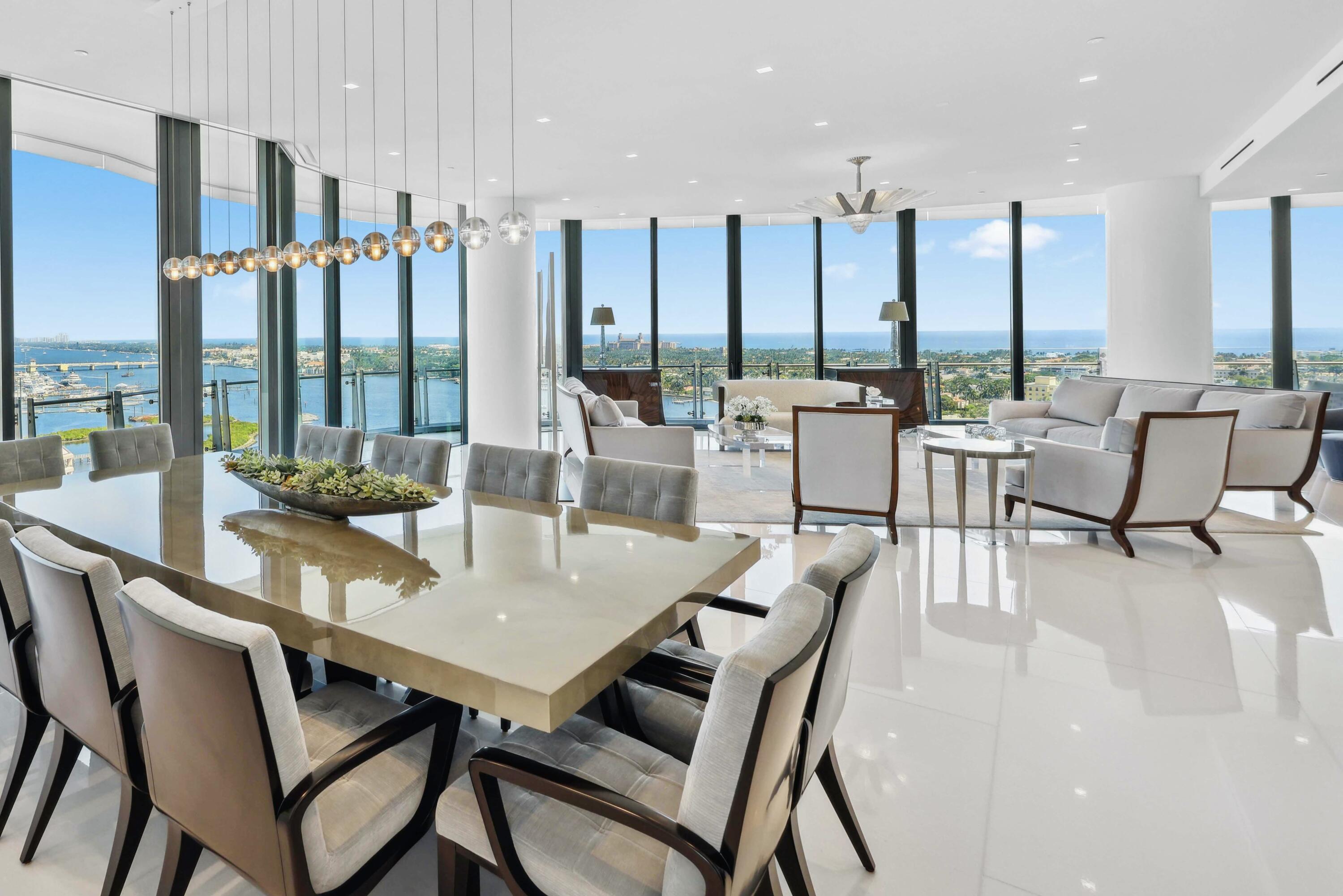 1100 South Flagler Drive, Unit 1801 West Palm Beach, FL 33401 - Photo 28 of 56 a view of a dining room with furniture large windows and wooden floor