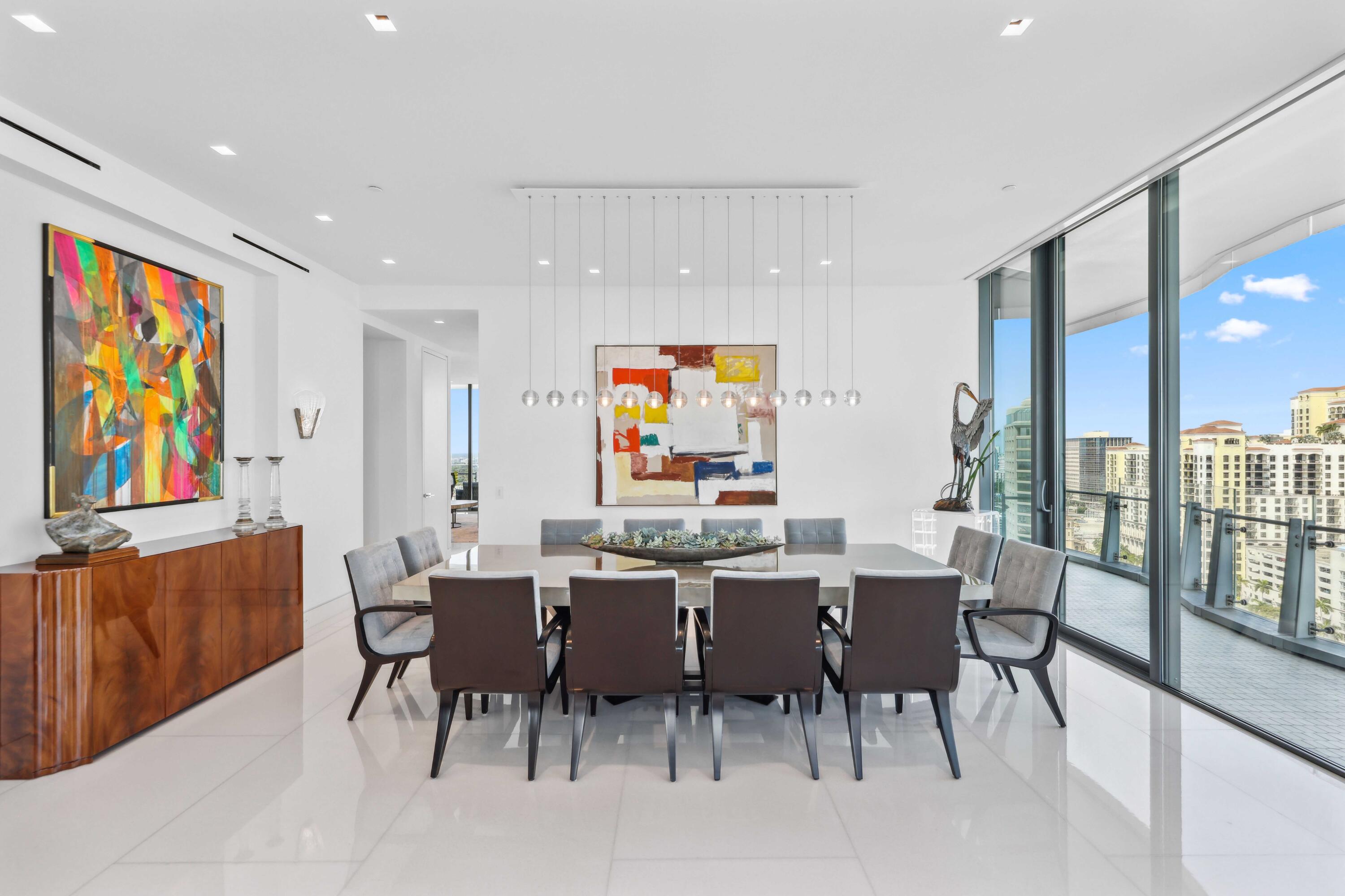 1100 South Flagler Drive, Unit 1801 West Palm Beach, FL 33401 - Photo 29 of 56 a view of a dining area with furniture and a potted plant