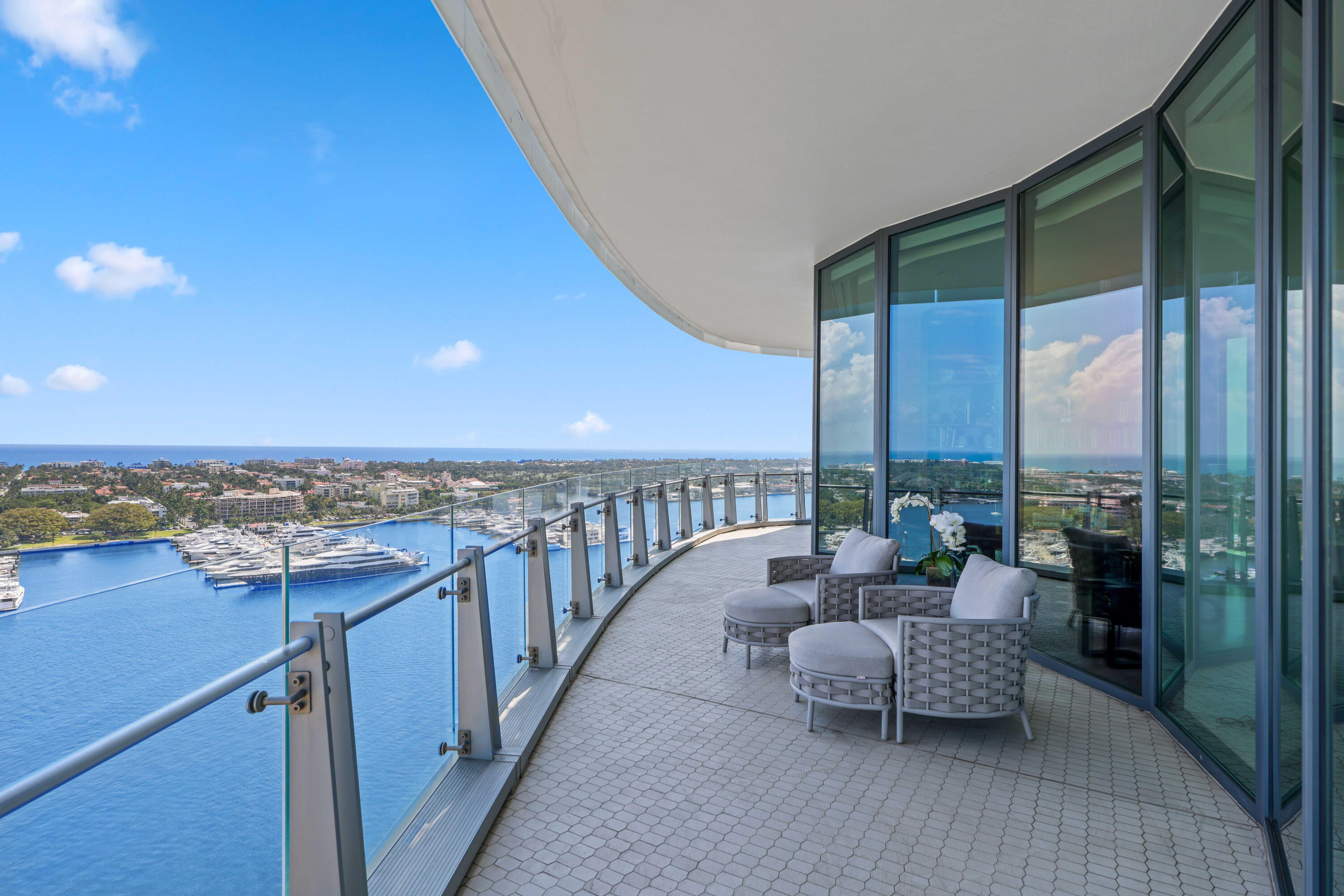 1100 South Flagler Drive, Unit 1801 West Palm Beach, FL 33401 - Photo 38 of 56 a balcony with furniture and city view