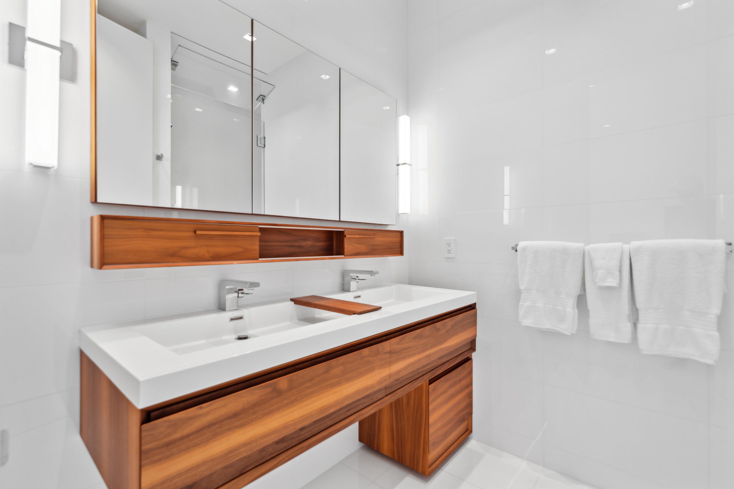 1100 South Flagler Drive, Unit 1801 West Palm Beach, FL 33401 - Photo 40 of 56 a bathroom with a sink and a mirror