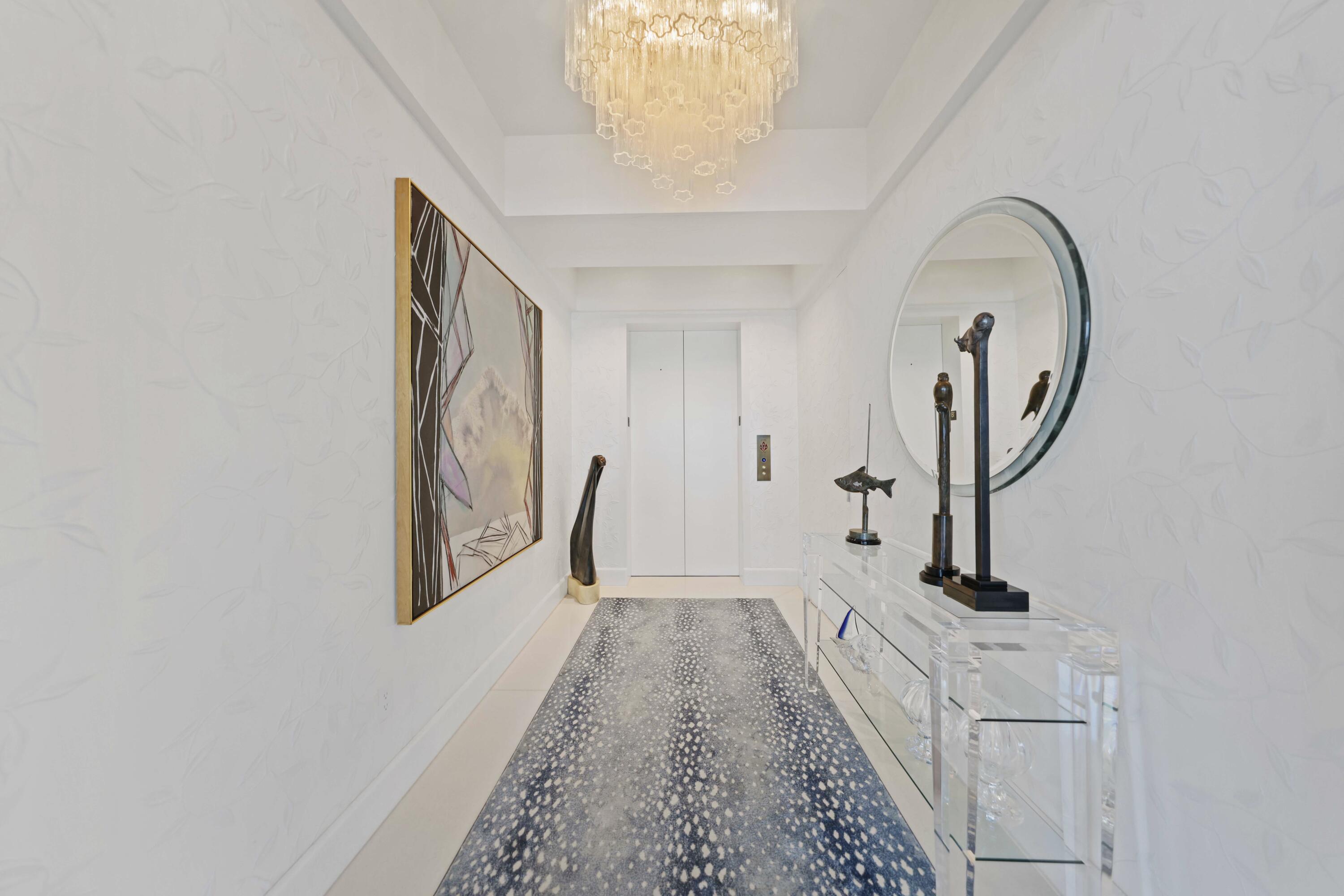 1100 South Flagler Drive, Unit 1801 West Palm Beach, FL 33401 - Photo 7 of 56 a view of a hallway with windows