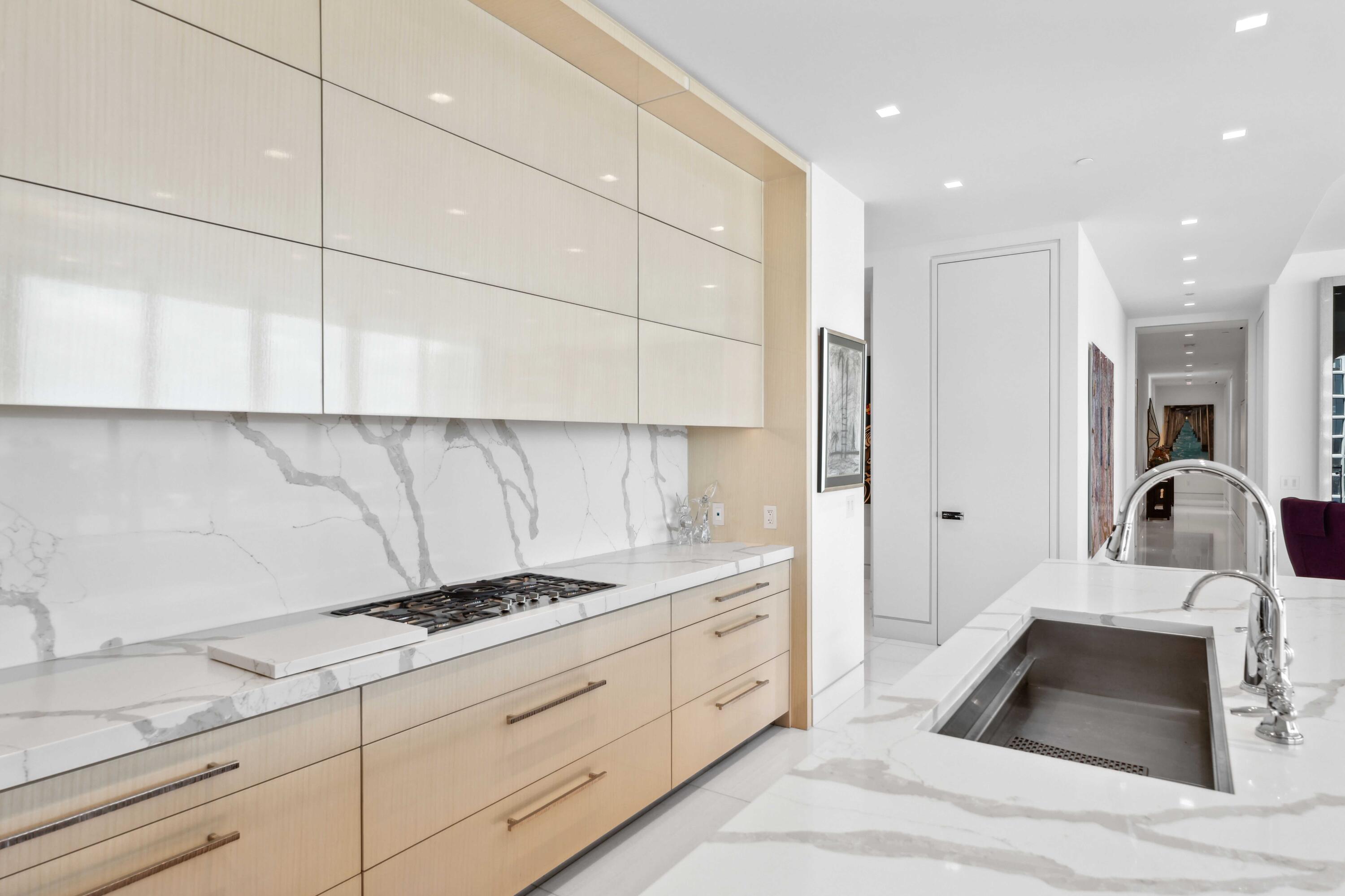 1100 South Flagler Drive, Unit 1801 West Palm Beach, FL 33401 - Photo 10 of 56 a kitchen with sink cabinets and appliances