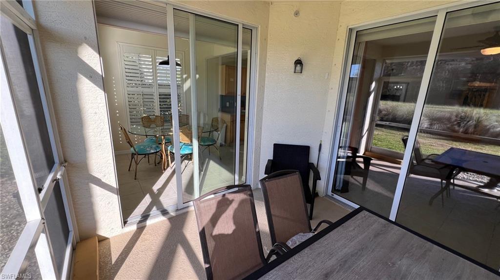 5705 Mayflower Way Ave Maria, FL 34142 - Photo 14 of 34 a view of a hallway with furniture and front door