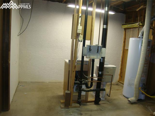 2965 Valencia Road Colorado Springs, CO 80917 - Photo 22 of 22 Laundry room has a sink and toilet all plumbed in. The Furnace (92% efficiency) was replaced in 2003, A/C added in 2003 as well.