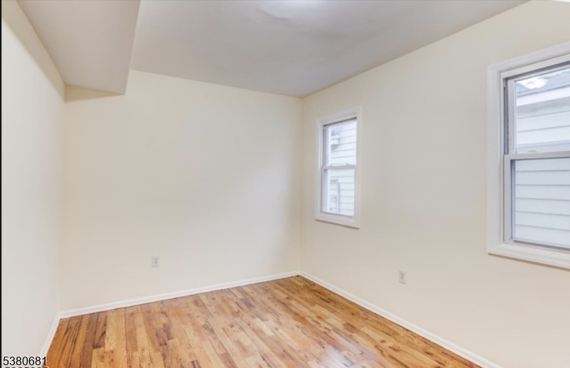 277 Wainwright Street Newark, NJ 07112 - Photo 9 of 11 an empty room with windows