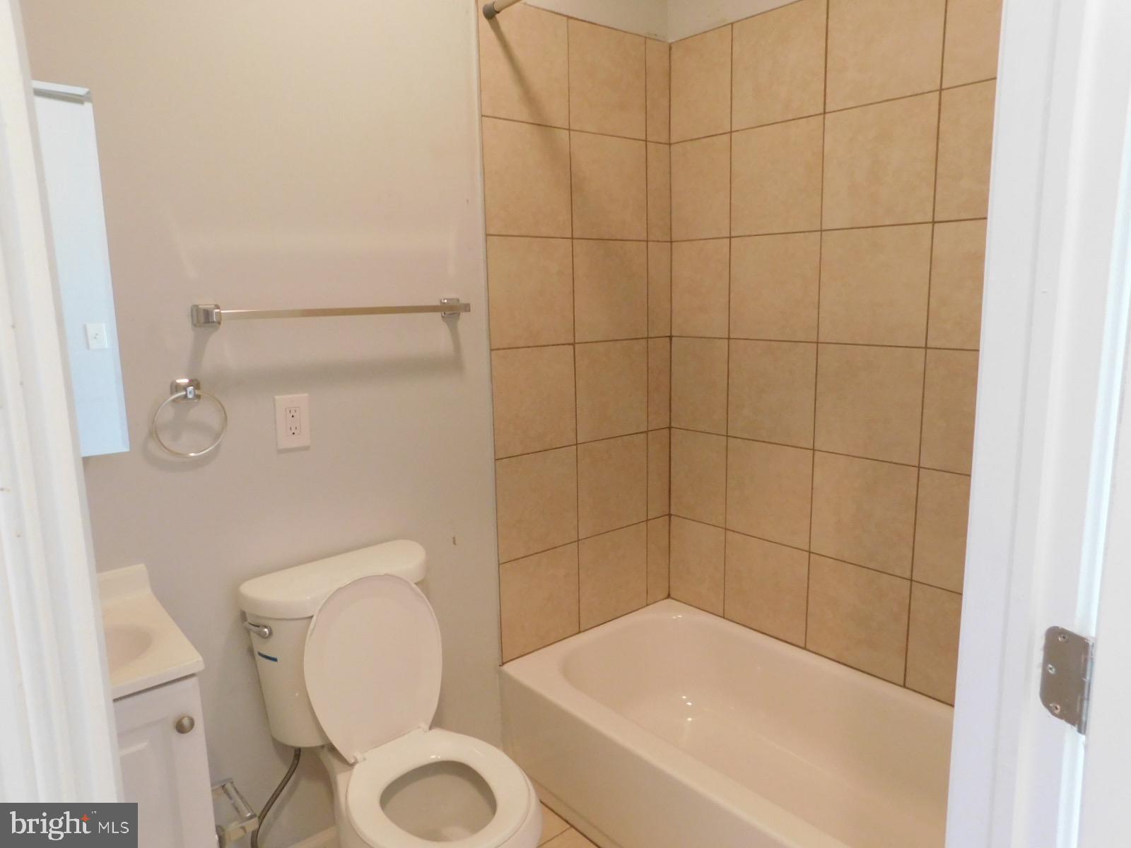 2238 Master Street Philadelphia, PA 19121 - Photo 11 of 24 a bathroom with a toilet and bathtub
