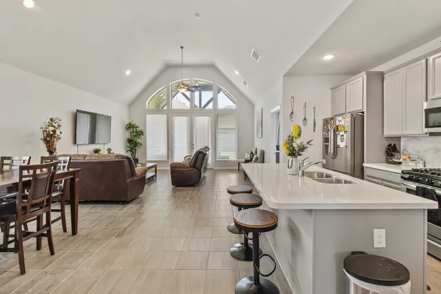 a view of kitchen with dining table and chairs