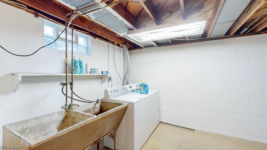 770 Yerrick Road Akron, OH 44312 - Photo 22 of 28 Laundry area with sink and washer and dryer