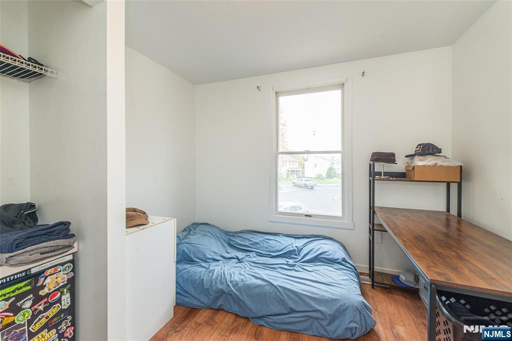 76 Constitution Way, Unit 534 Franklin, NJ 07416 - Photo 12 of 22 a bedroom with a bed and a window