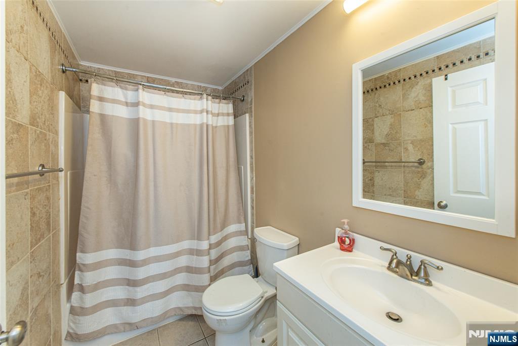 76 Constitution Way, Unit 534 Franklin, NJ 07416 - Photo 16 of 22 a bathroom with a sink toilet and shower