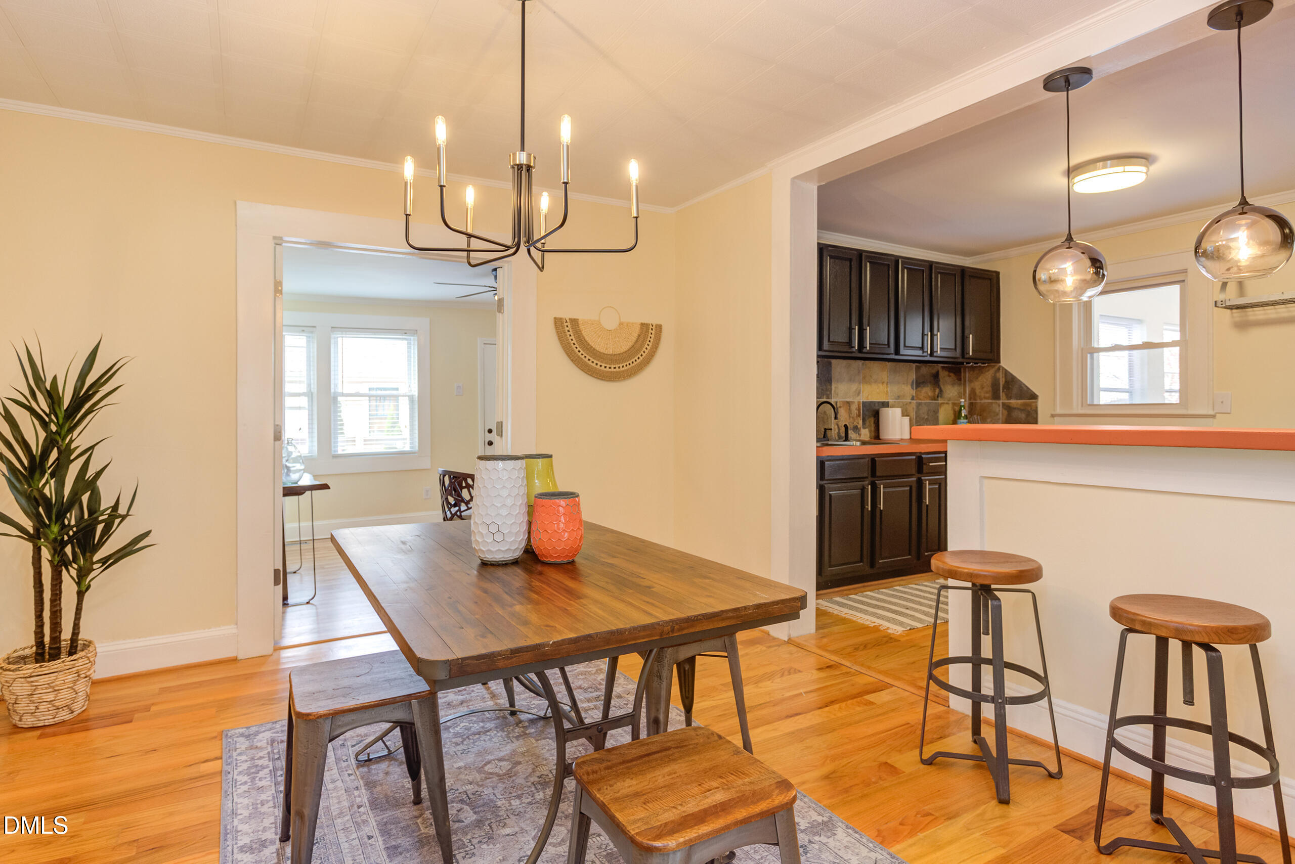 1109 North Elizabeth Street Durham, NC 27701 - Photo 14 of 44 a view of a dining room with furniture and a chandelier