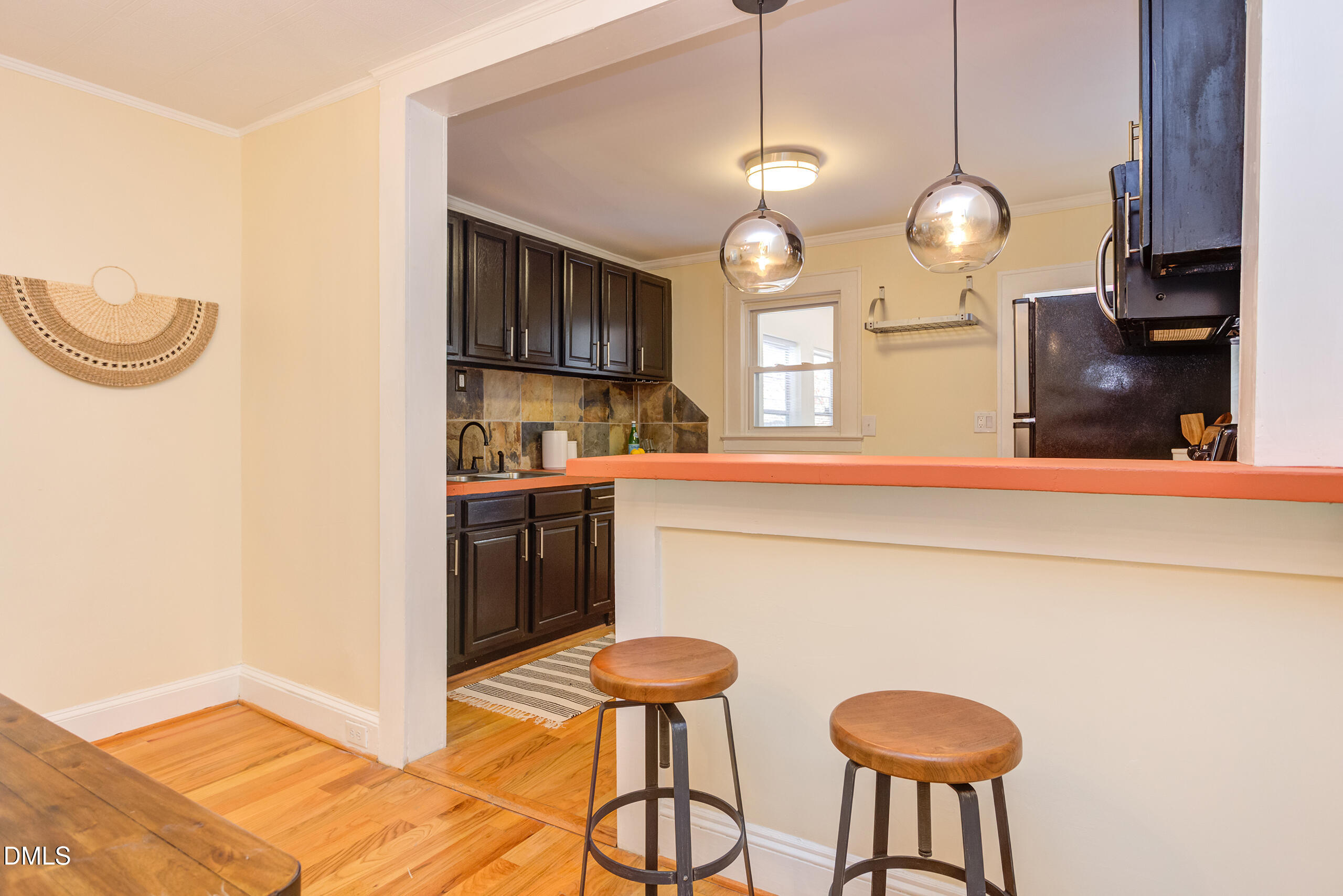 1109 North Elizabeth Street Durham, NC 27701 - Photo 15 of 44 a kitchen with stainless steel appliances granite countertop a sink a stove cabinets and a dining table