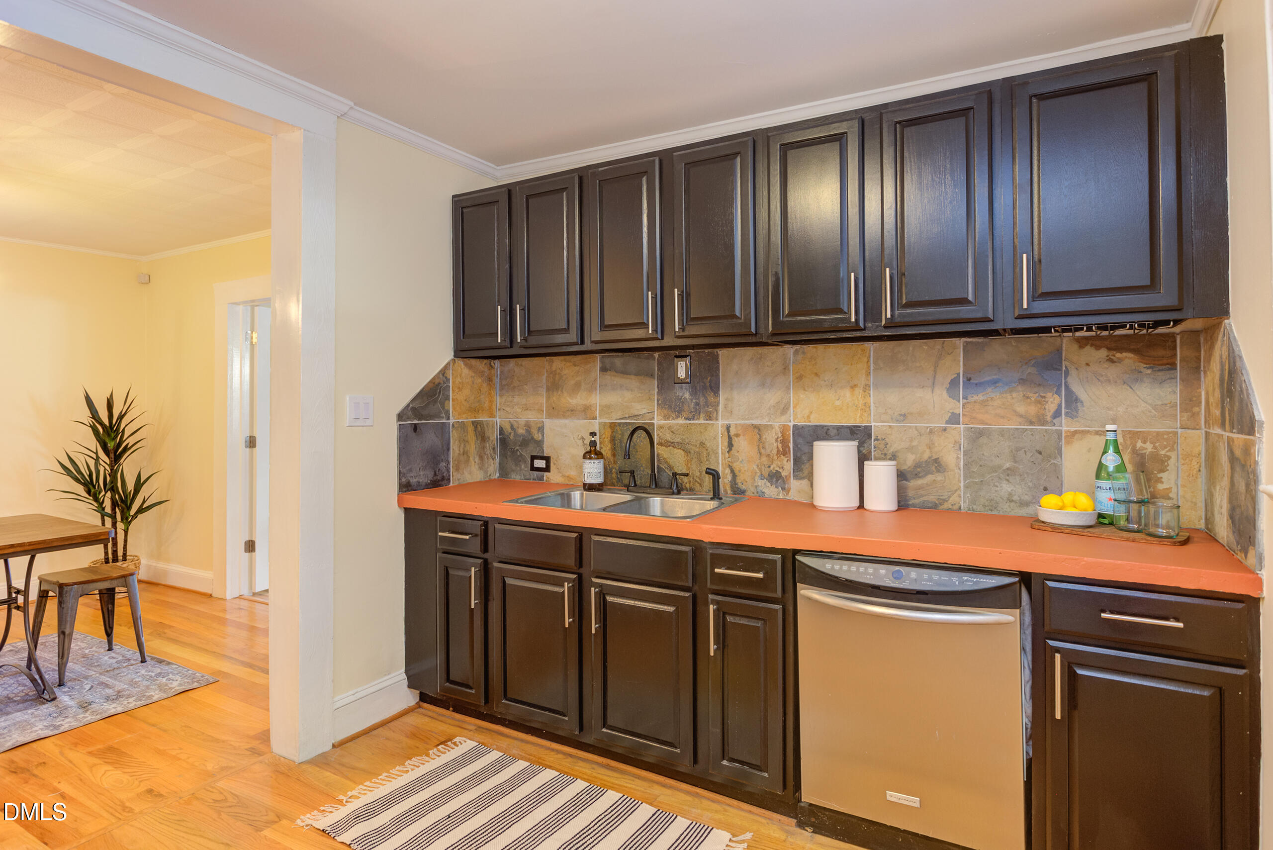 1109 North Elizabeth Street Durham, NC 27701 - Photo 19 of 44 a kitchen with stainless steel appliances granite countertop wooden cabinets a sink and dishwasher