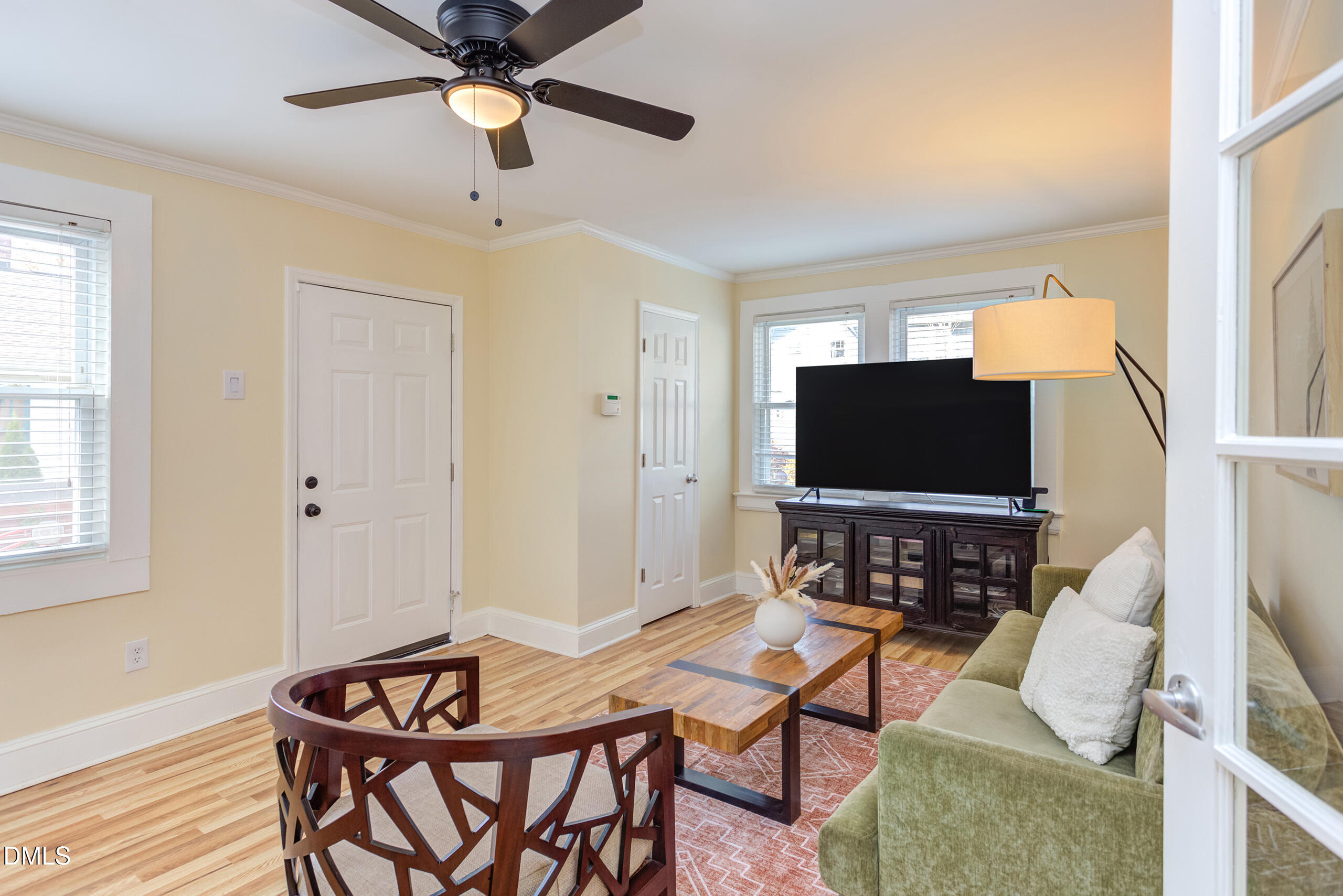 1109 North Elizabeth Street Durham, NC 27701 - Photo 21 of 44 a living room with furniture a flat screen tv and a window