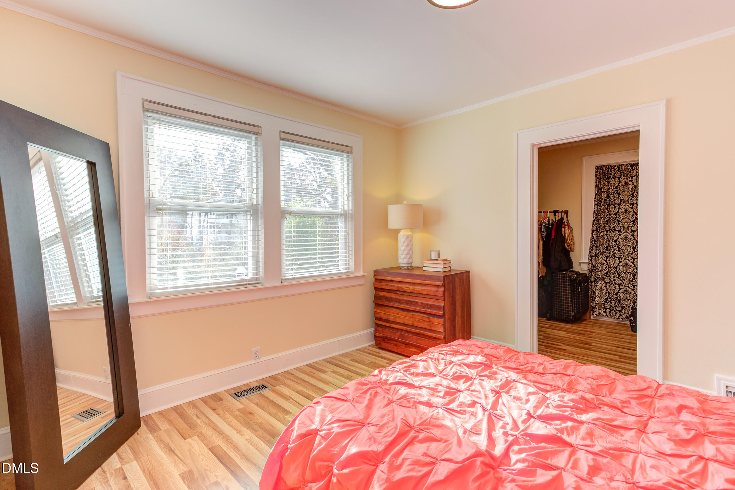 1109 North Elizabeth Street Durham, NC 27701 - Photo 32 of 44 a bedroom with a bed and wooden floor