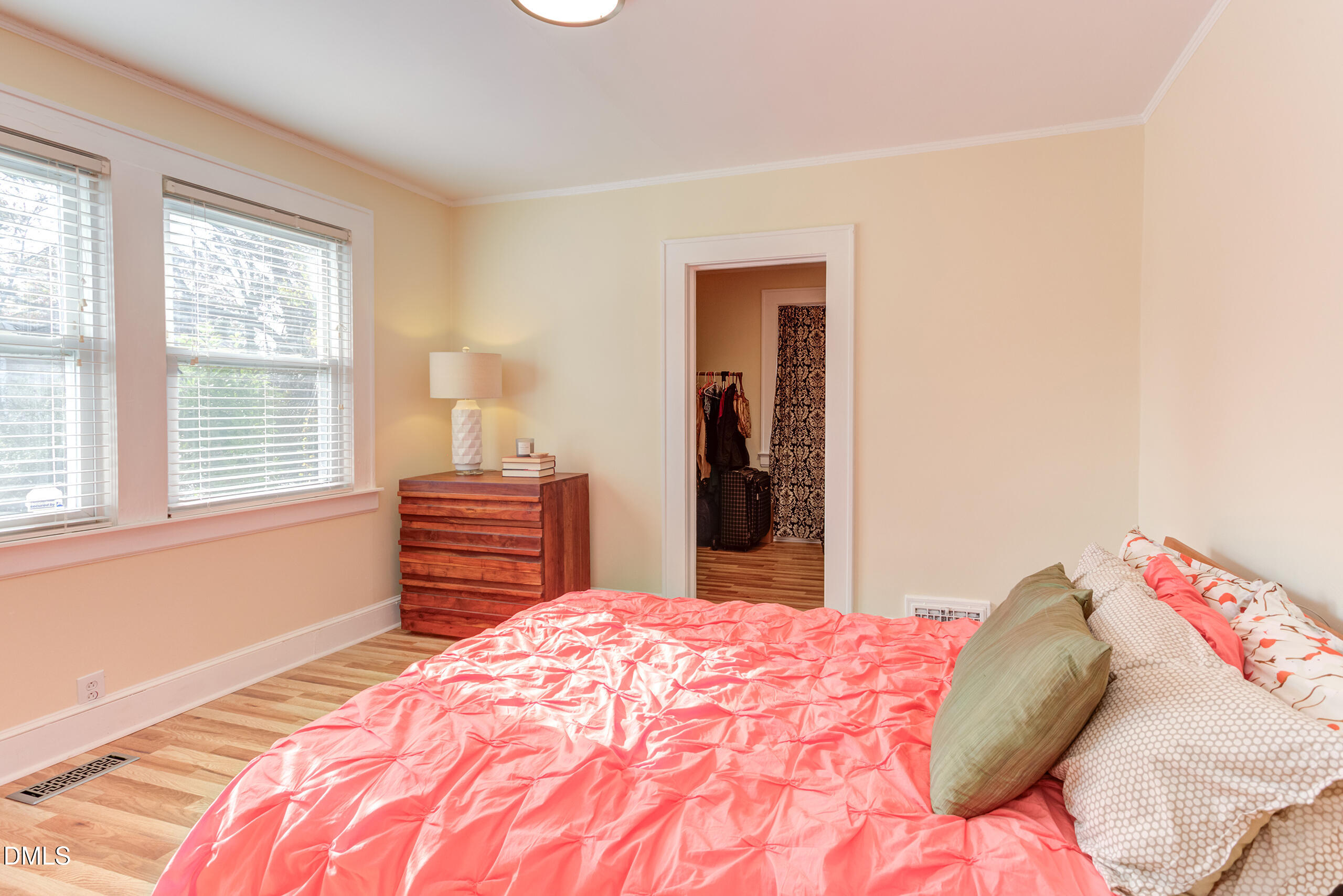 1109 North Elizabeth Street Durham, NC 27701 - Photo 33 of 44 a bedroom with a bed and a dresser next to a window
