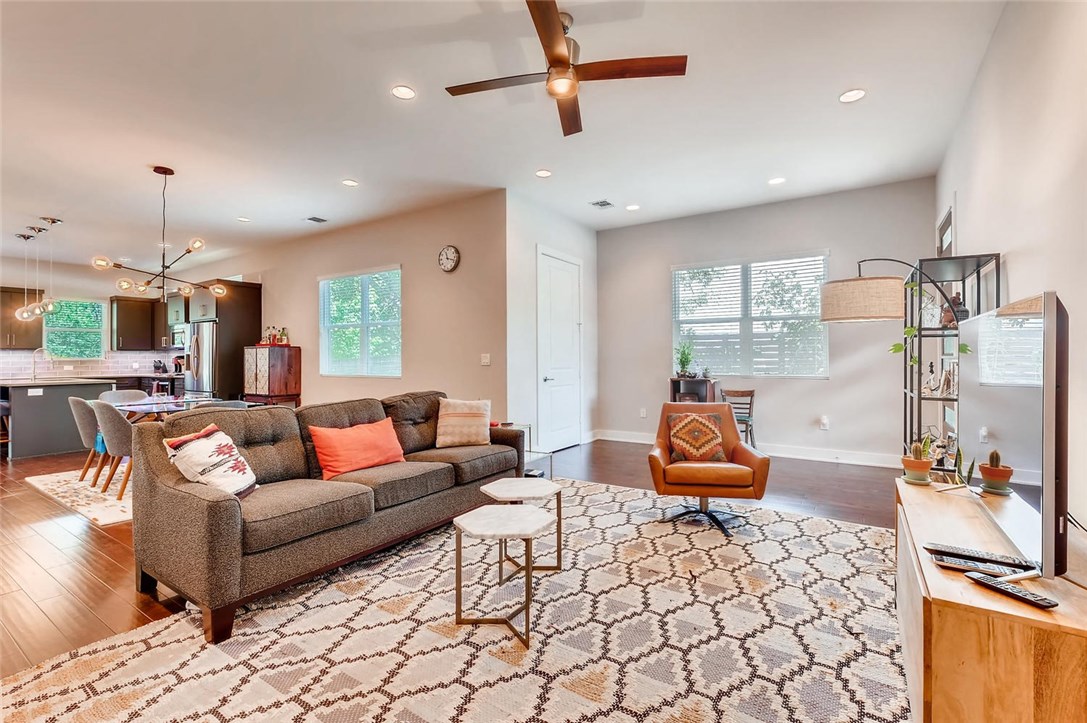 1730 Bunche Road, Unit B Austin, TX 78721 - Photo 1 of 1 a living room with furniture and a chandelier