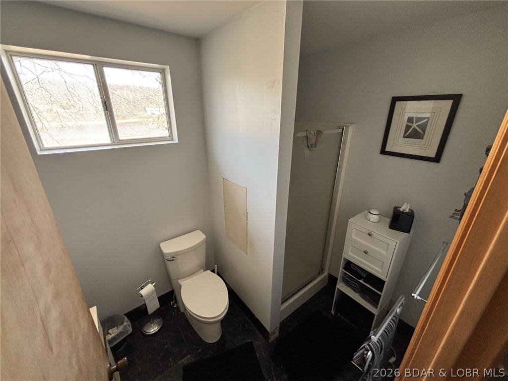 1265 Lick Creek Road Edwards, MO 65326 - Photo 16 of 29 main level bath walk in shower