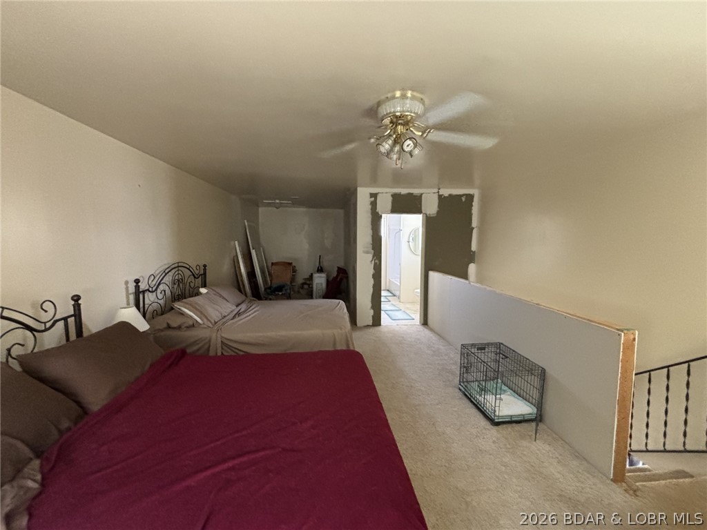 1265 Lick Creek Road Edwards, MO 65326 - Photo 20 of 29 another view of great room - storage and bathroom
