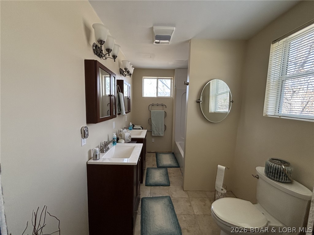 1265 Lick Creek Road Edwards, MO 65326 - Photo 21 of 29 upper level bathroom, double vanity tub shower