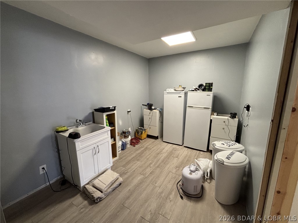 1265 Lick Creek Road Edwards, MO 65326 - Photo 25 of 29 view from water softener to rest of utility room