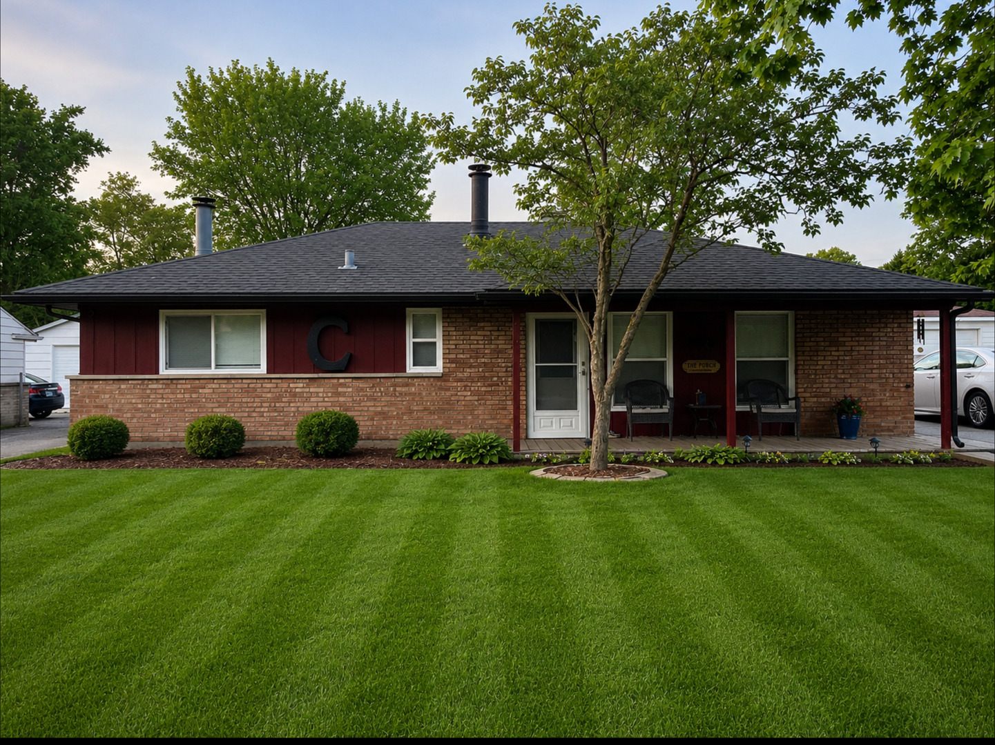a front view of house with yard and green space