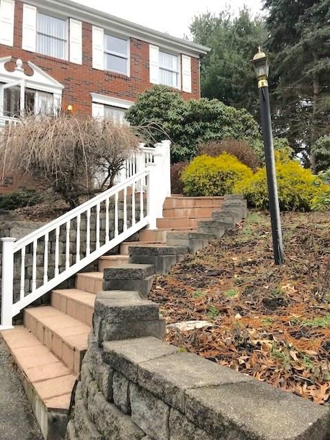 655 Waterdam Road Canonsburg, PA 15317 - Photo 3 of 25 Stairs going to the house. Plants that will bloom in the spring and summer.