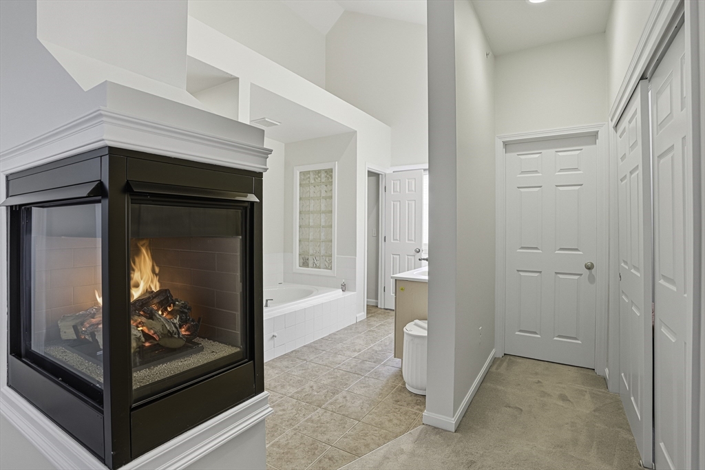 153 America Boulevard, Unit 153 Ashland, MA 01721 - Photo 30 of 42 a view of a room that has a large door
