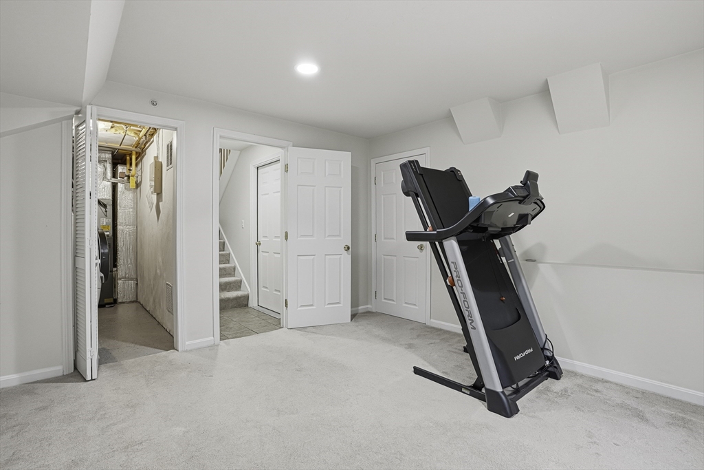 153 America Boulevard, Unit 153 Ashland, MA 01721 - Photo 38 of 42 a view of a room with gym equipment