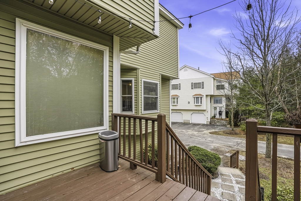 153 America Boulevard, Unit 153 Ashland, MA 01721 - Photo 42 of 42 a view of a house with wooden deck