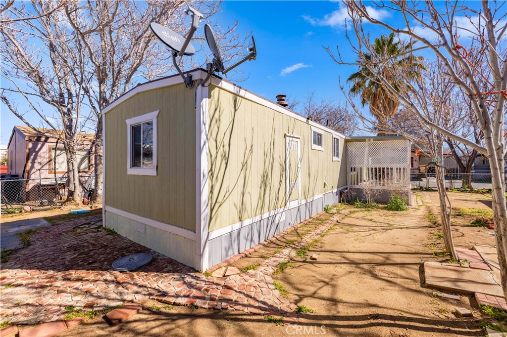 43850 20th Street East, Unit 265 Lancaster, CA 93535 - Photo 16 of 19 a view of a house with a snow on the road