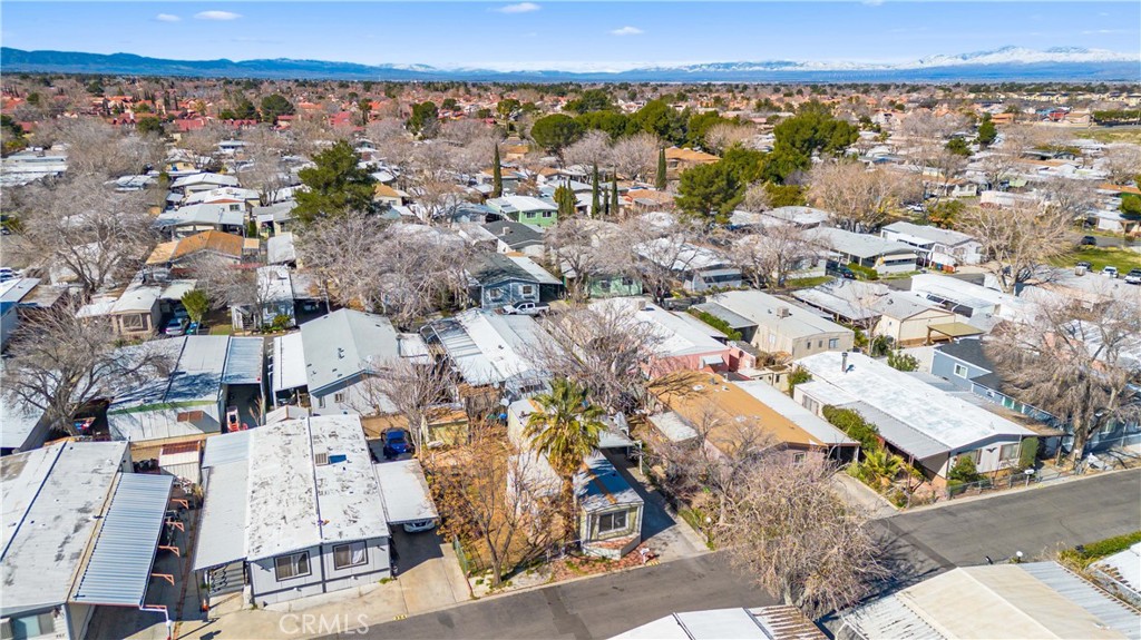 43850 20th Street East, Unit 265 Lancaster, CA 93535 - Photo 2 of 19 an aerial view of residential houses with outdoor space