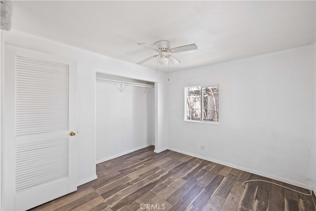43850 20th Street East, Unit 265 Lancaster, CA 93535 - Photo 10 of 19 wooden floor in an empty room with a window