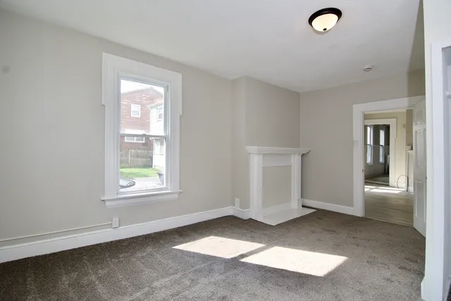 a view of wooden floor and windows in a room