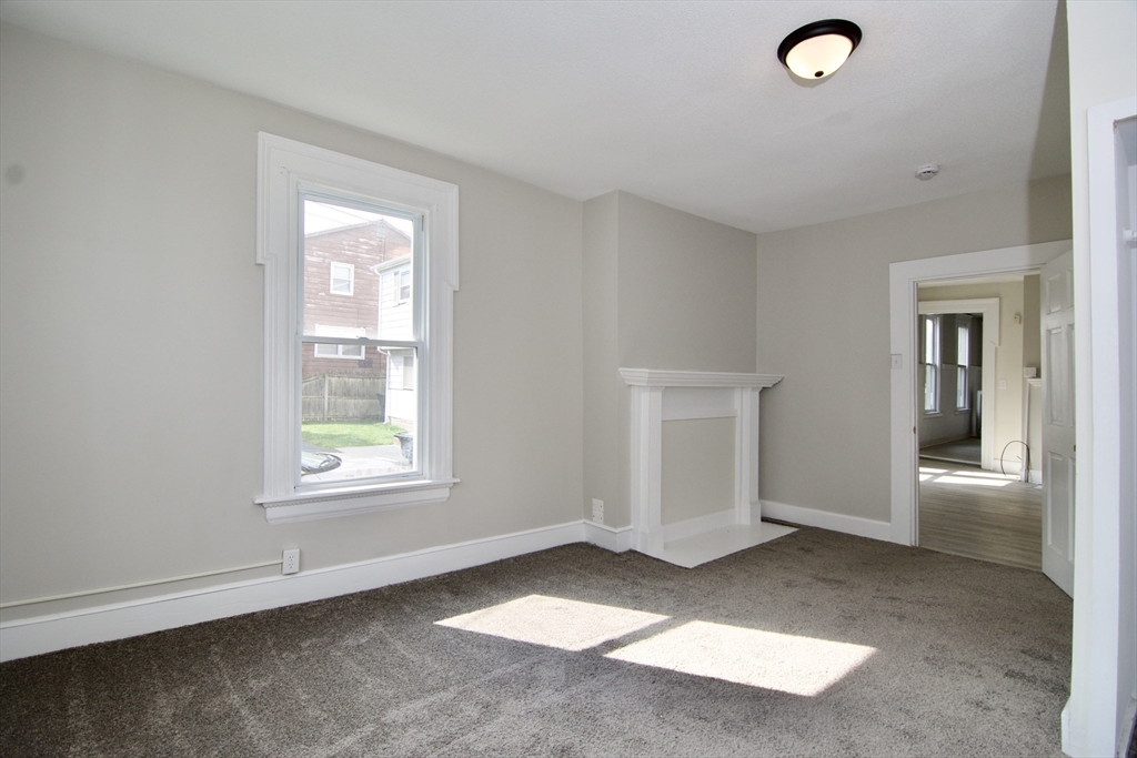 58 Howes Street, Unit 1 Springfield, MA 01118 - Photo 12 of 24 an empty room with windows and closet
