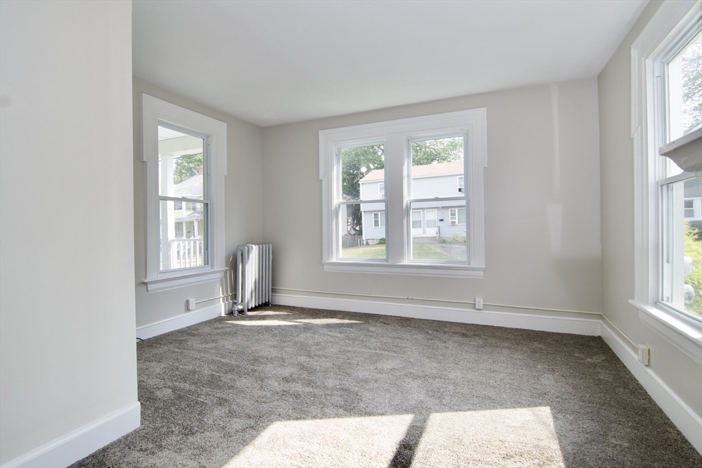 58 Howes Street, Unit 1 Springfield, MA 01118 - Photo 13 of 24 a view of wooden floor and windows in a room
