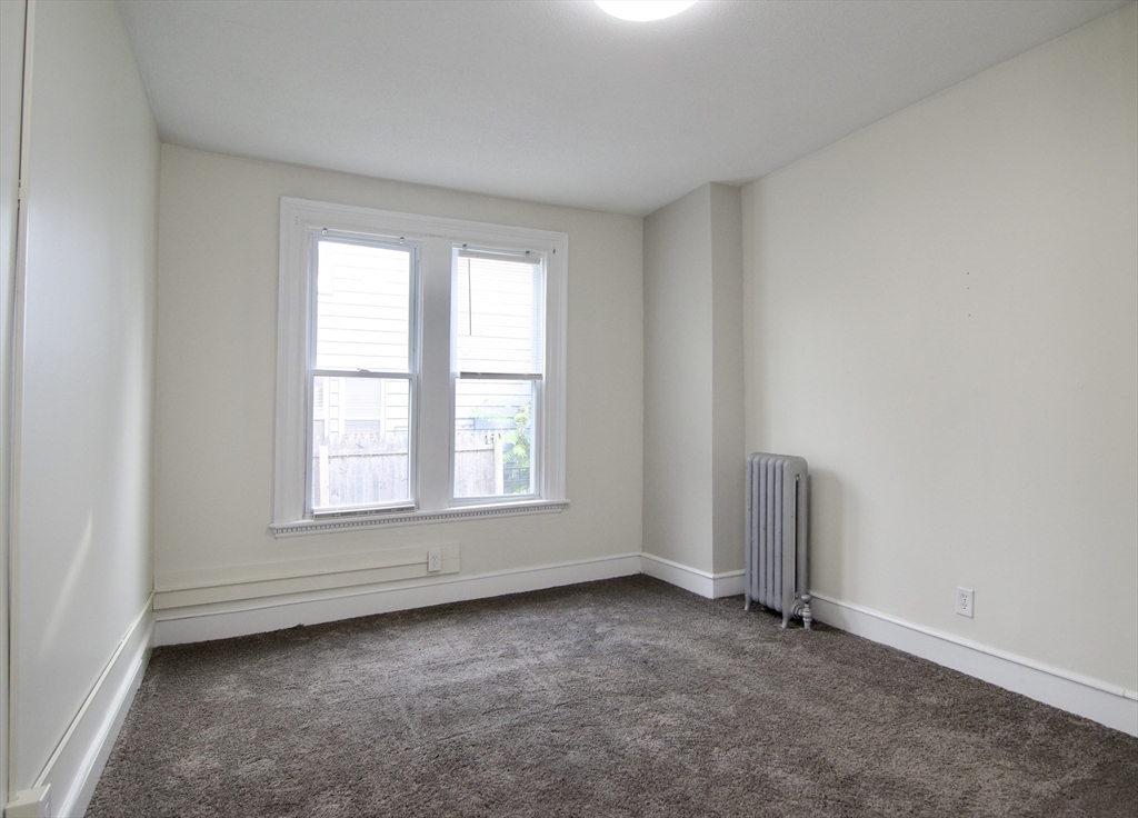 58 Howes Street, Unit 1 Springfield, MA 01118 - Photo 15 of 24 an empty room with a window