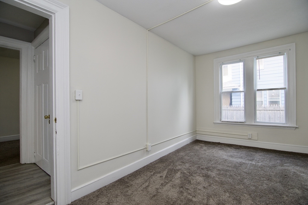 58 Howes Street, Unit 1 Springfield, MA 01118 - Photo 18 of 24 a view of room with window and hardwood floor